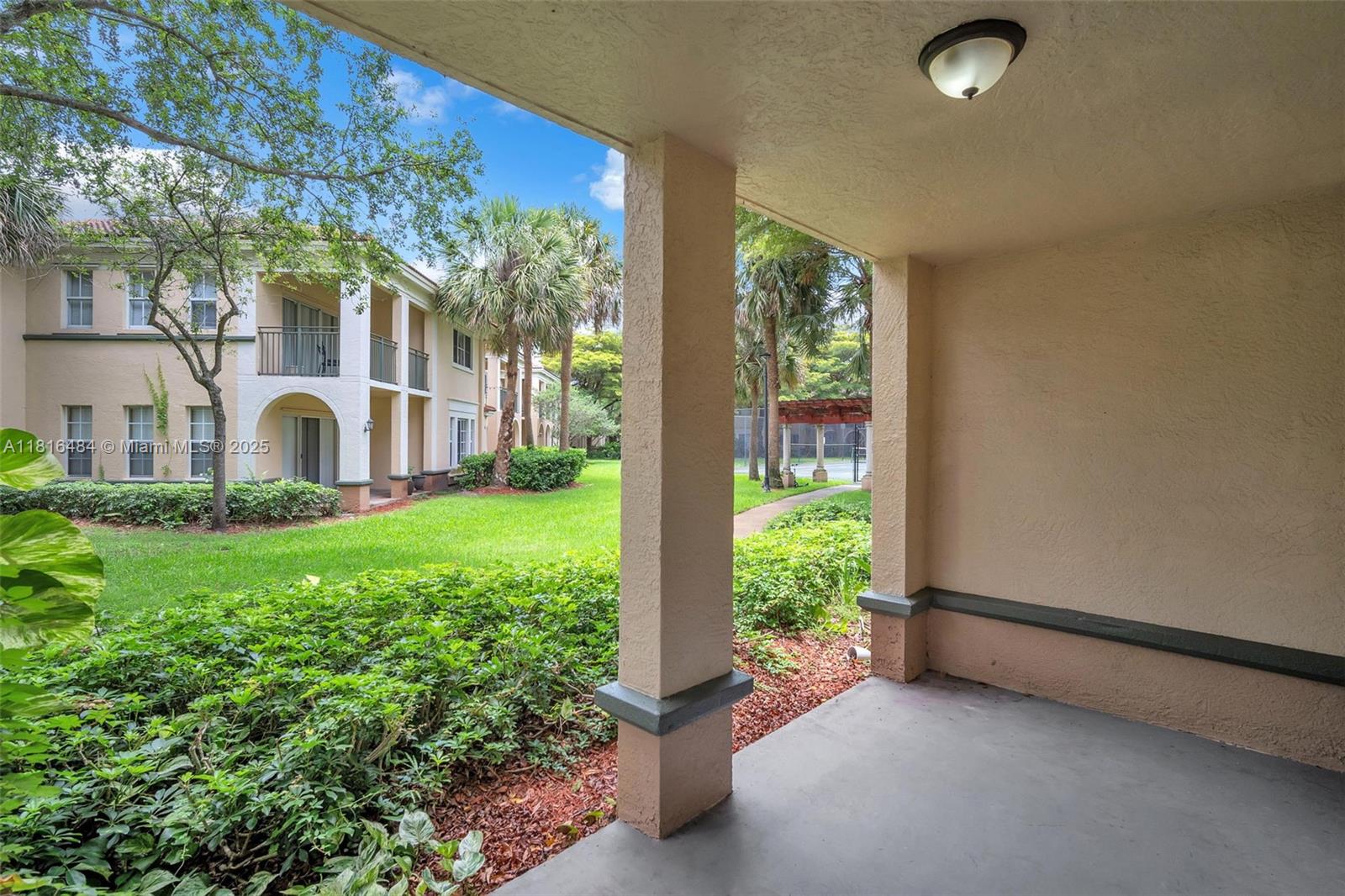 2474 Centergate Drive, Unit 101 Miramar, FL 33025 - Photo 23 of 28 a view of a house with backyard and garden