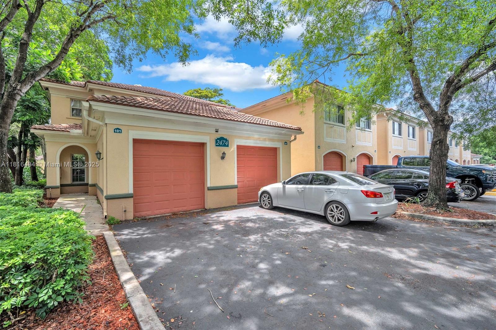 2474 Centergate Drive, Unit 101 Miramar, FL 33025 - Photo 28 of 28 a view of a car in front of house