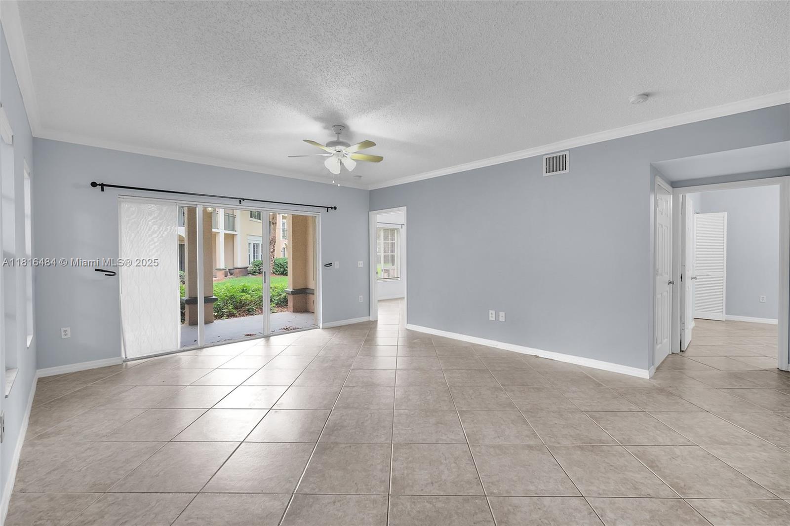 2474 Centergate Drive, Unit 101 Miramar, FL 33025 - Photo 4 of 28 a view of an empty room with a window