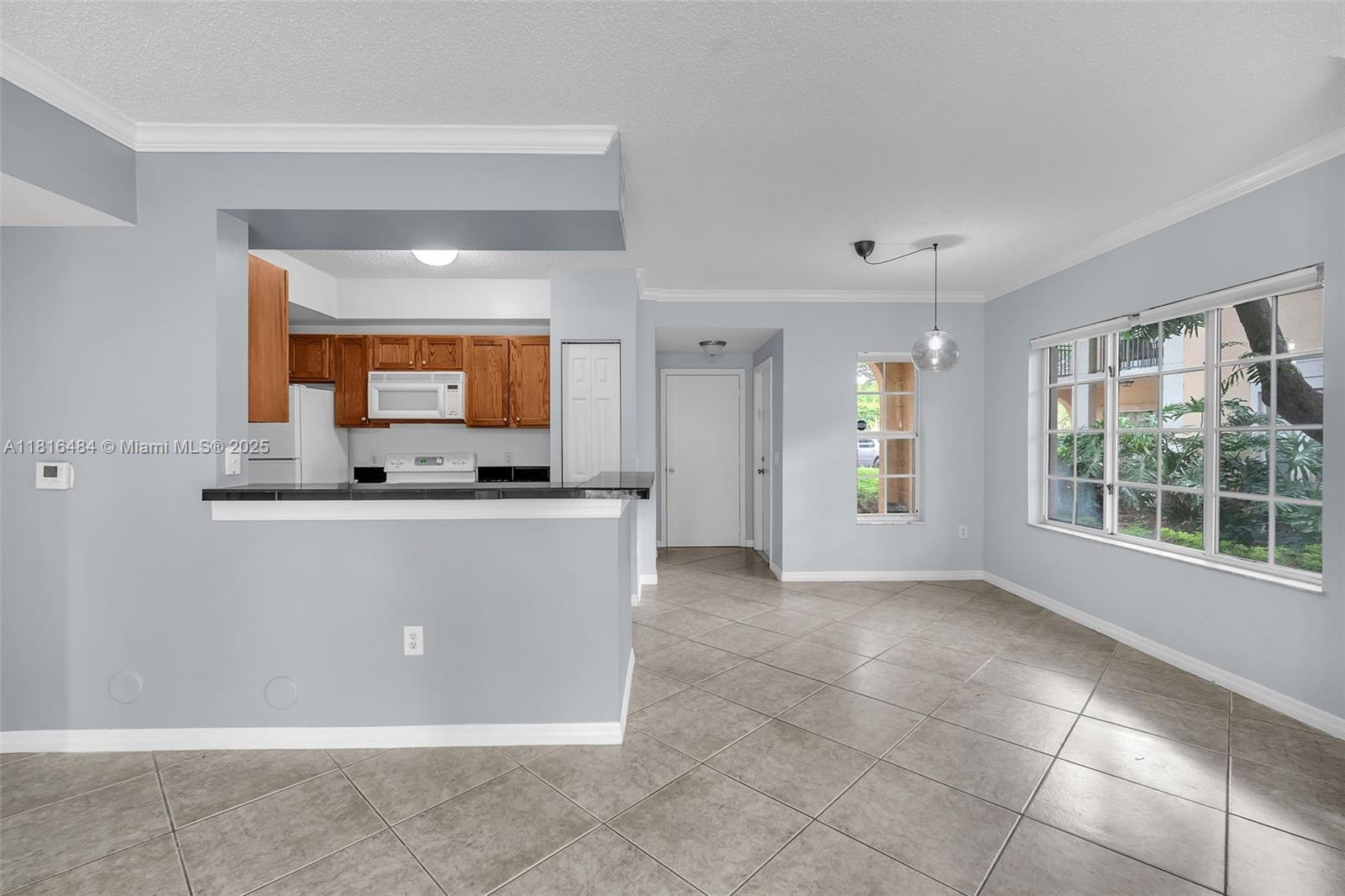 2474 Centergate Drive, Unit 101 Miramar, FL 33025 - Photo 9 of 28 a view of a kitchen with a sink
