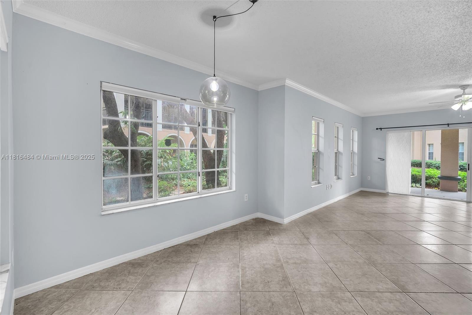2474 Centergate Drive, Unit 101 Miramar, FL 33025 - Photo 10 of 28 a view of an empty room with a window