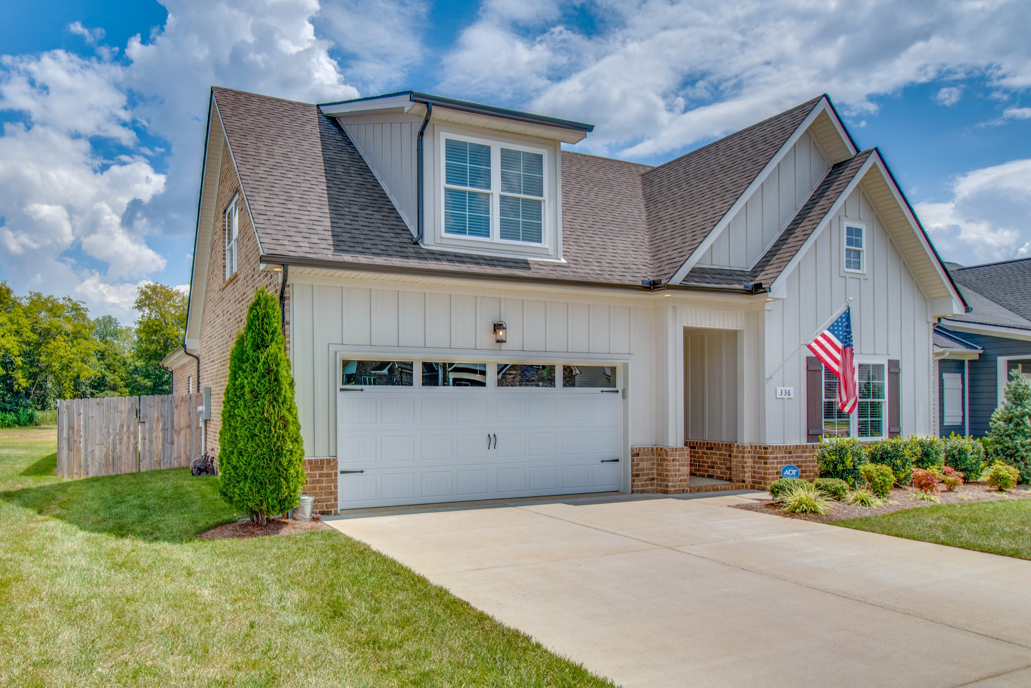 a front view of house with garage and yard