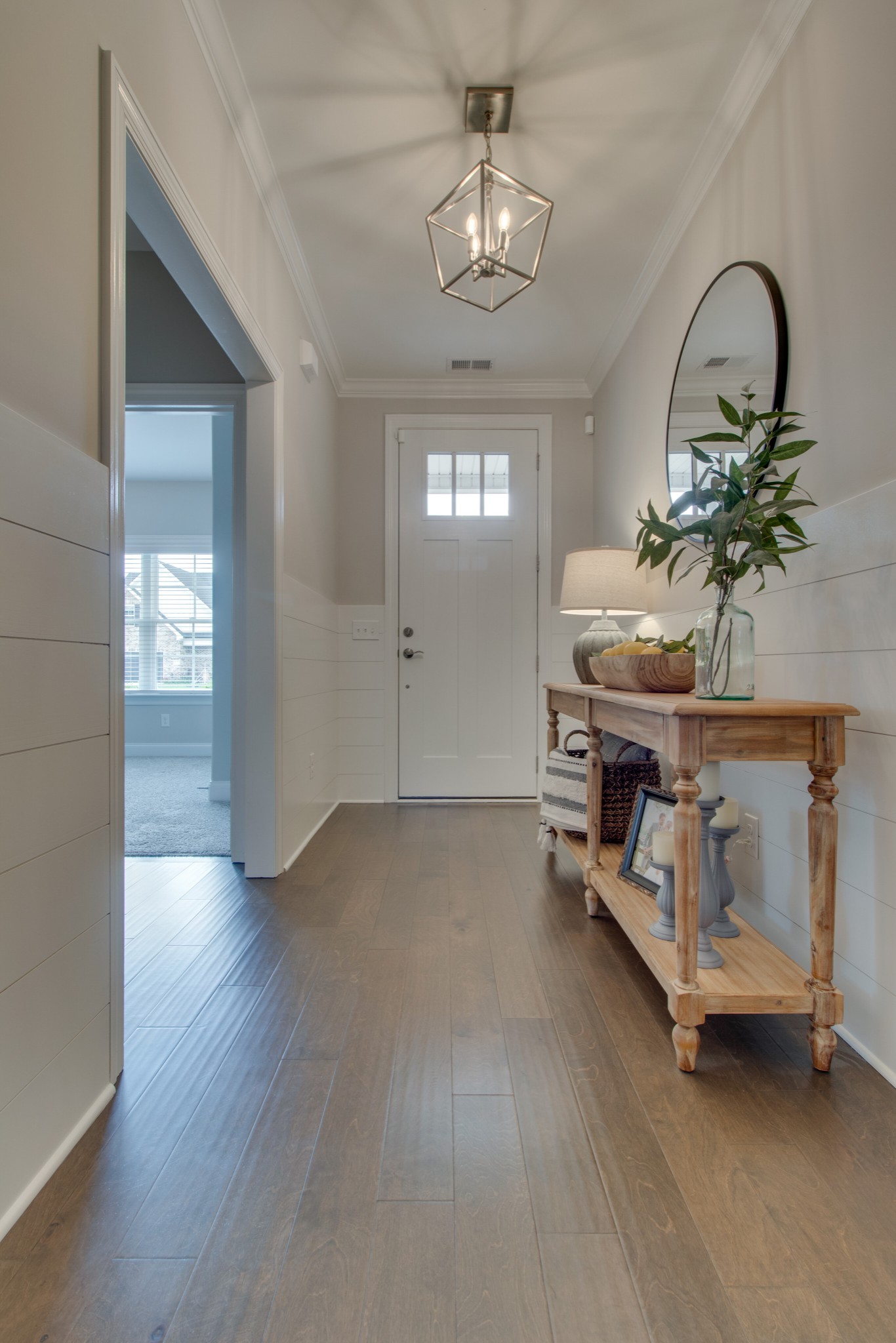 336 Beulah Rose Drive Murfreesboro, TN 37128 - Photo 8 of 42 a view of a room with wooden floor and chandelier