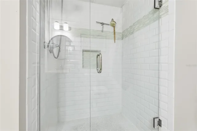 a view of a chairs and table in patio with a lake view