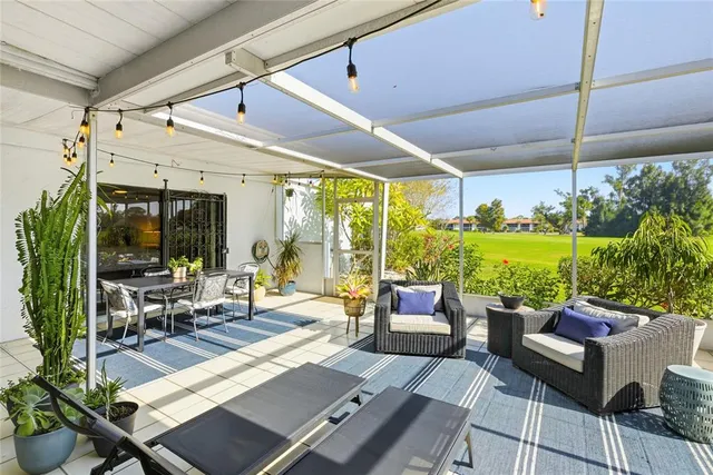 a view of field with tall trees