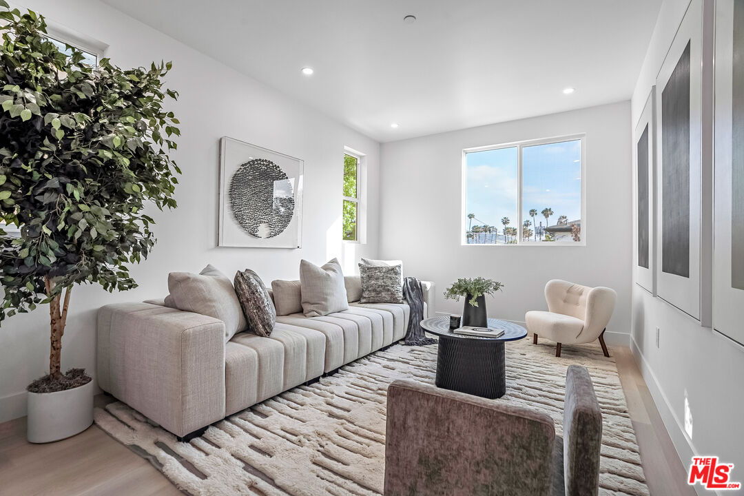 5830 David Avenue Los Angeles, CA 90034 - Photo 19 of 46 a living room with furniture and a large window