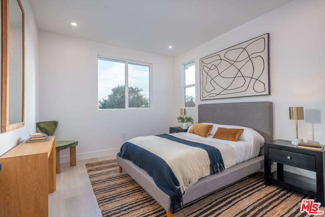 5830 David Avenue Los Angeles, CA 90034 - Photo 21 of 46 a bedroom with a bed and wooden floor