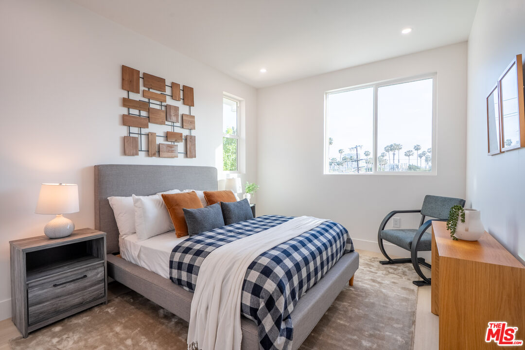 5830 David Avenue Los Angeles, CA 90034 - Photo 22 of 46 a bedroom with bed and a window