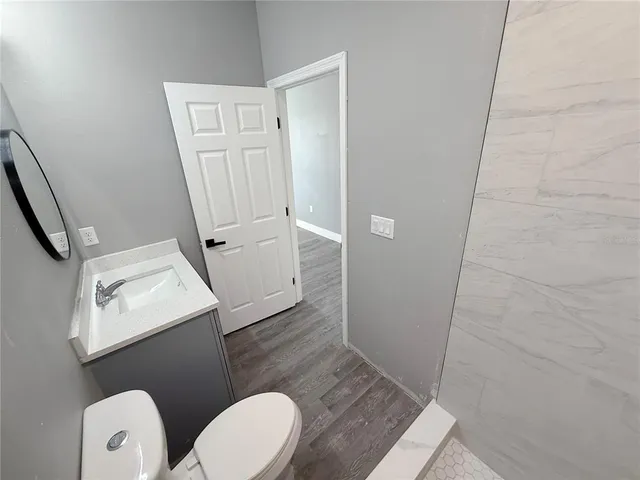 a bathroom with a toilet and a sink