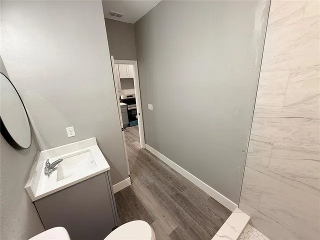 a bathroom with a sink and toilet