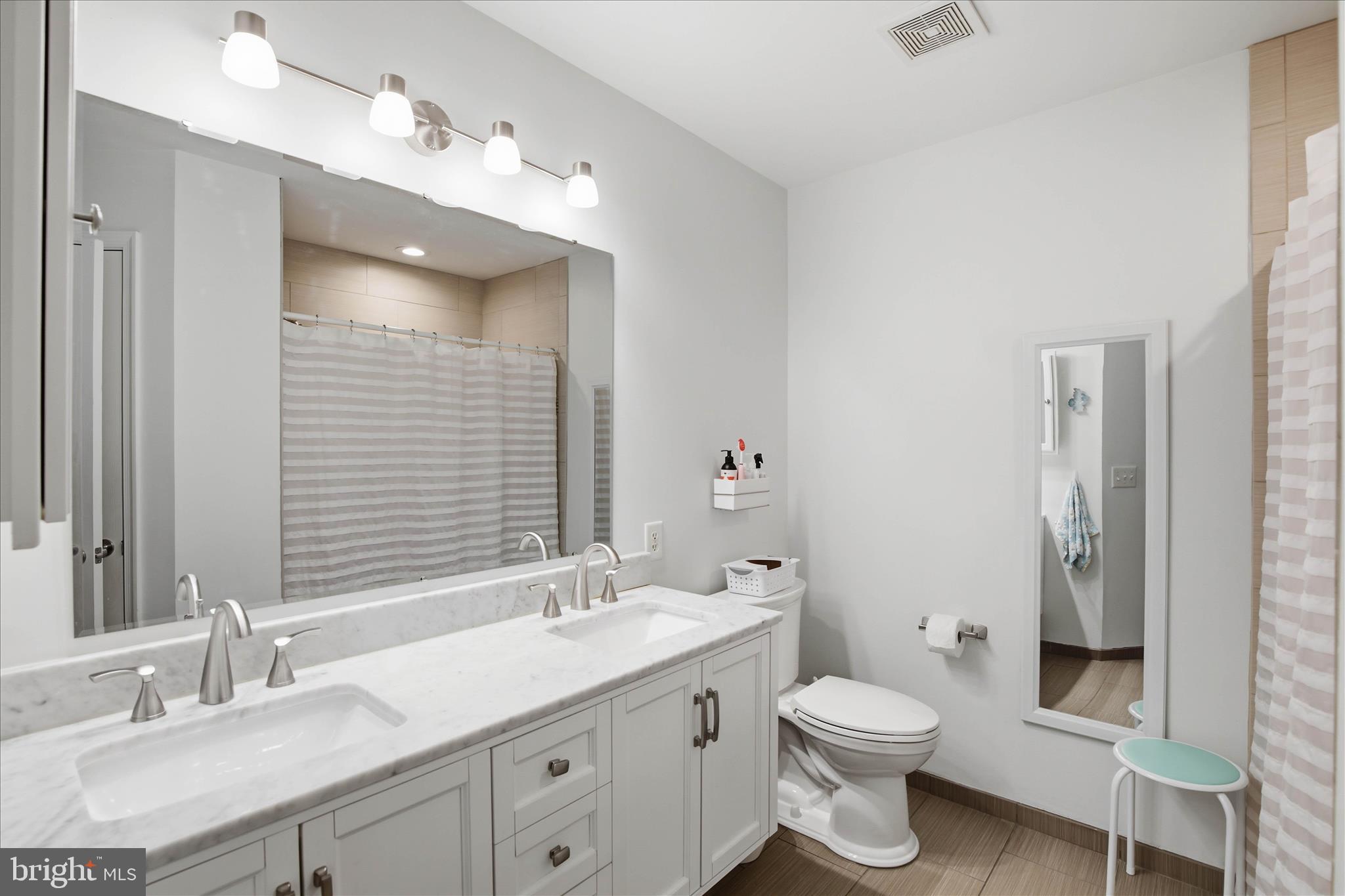 52 Coopers Way Denver, PA 17517 - Photo 17 of 29 a bathroom with a double vanity sink toilet and shower