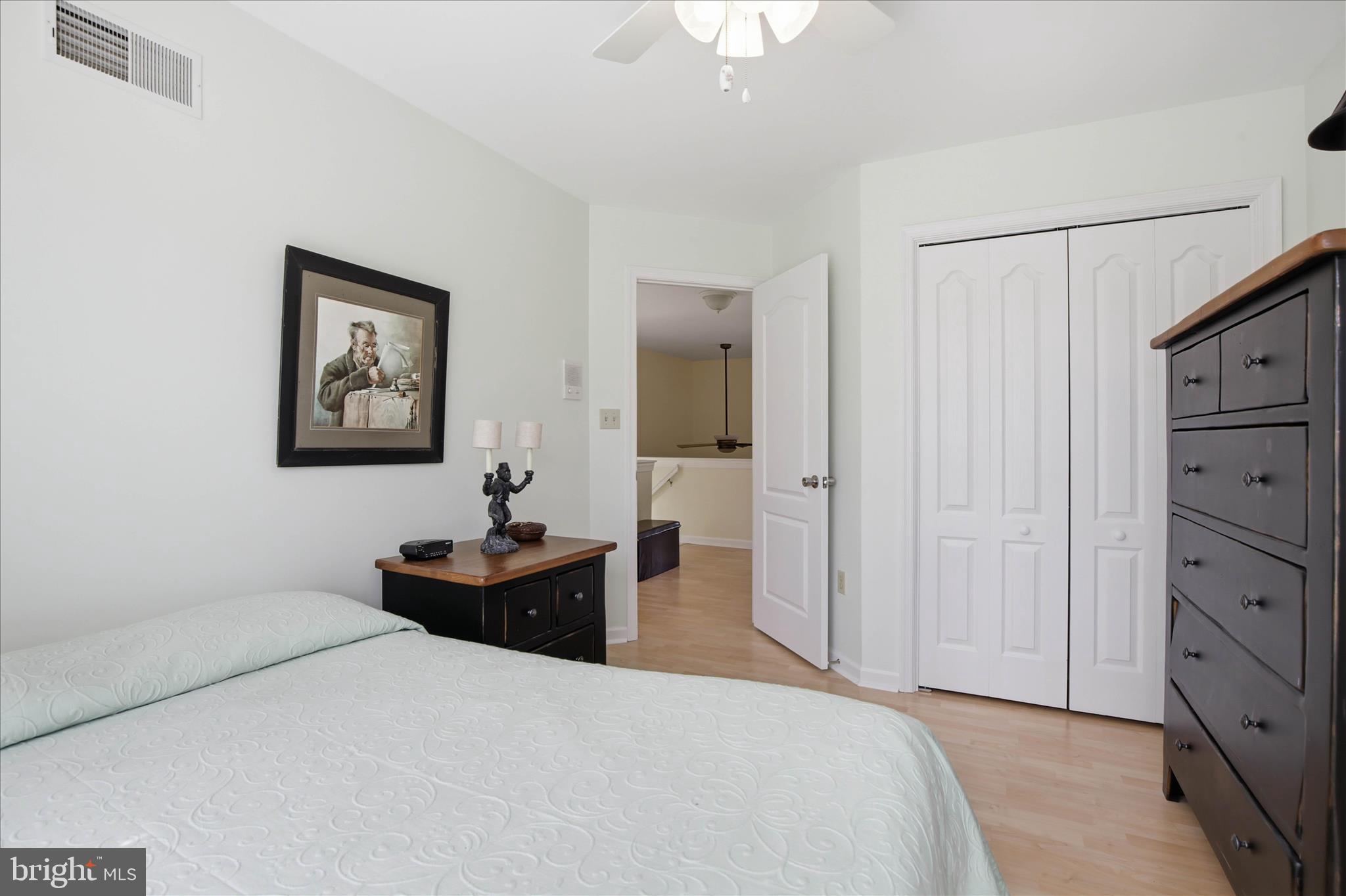 52 Coopers Way Denver, PA 17517 - Photo 24 of 29 a bedroom with a bed and a chandelier