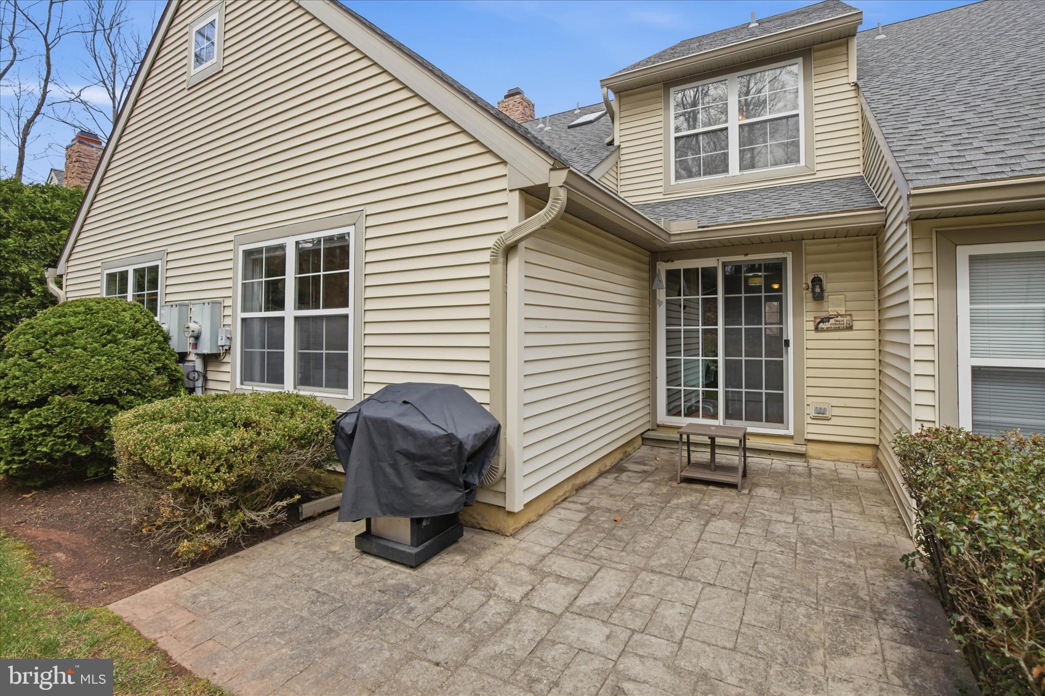 52 Coopers Way Denver, PA 17517 - Photo 26 of 29 a backyard of a house with barbeque oven and potted plants