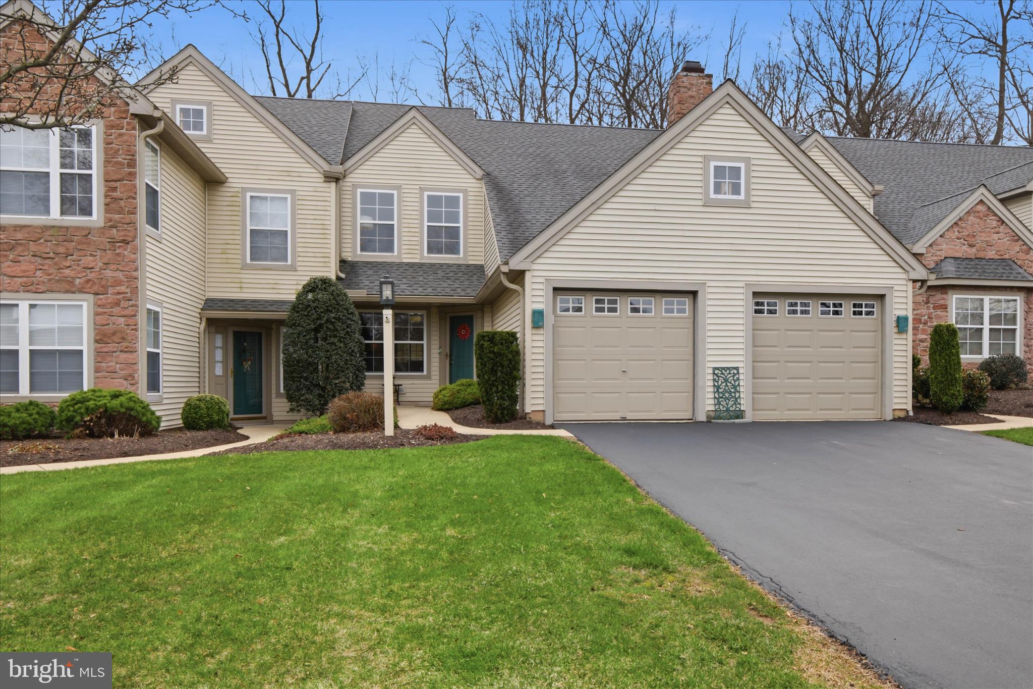 52 Coopers Way Denver, PA 17517 - Photo 3 of 29 a front view of a house with a yard and garage