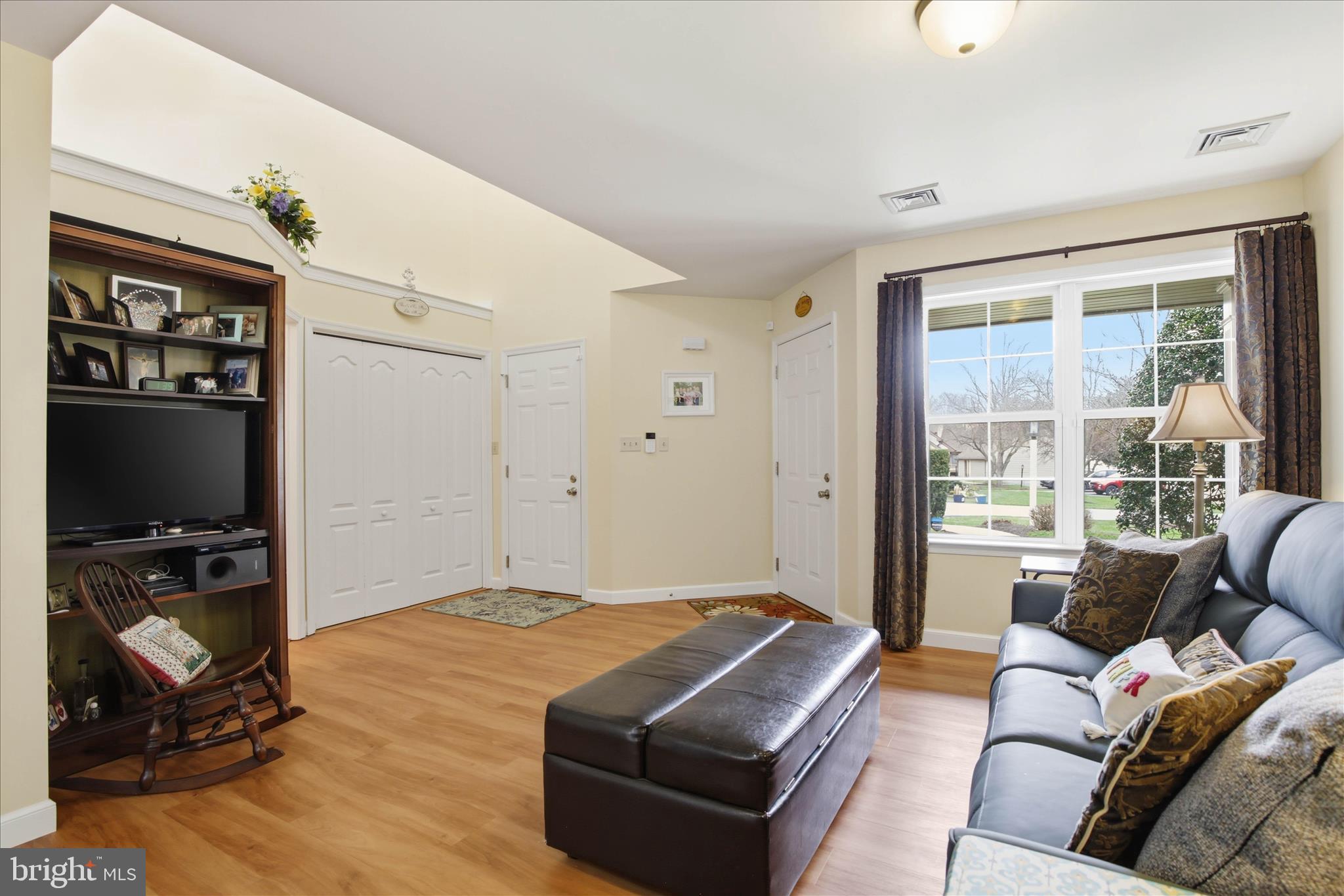 52 Coopers Way Denver, PA 17517 - Photo 5 of 29 a living room with furniture a flat screen tv and a window