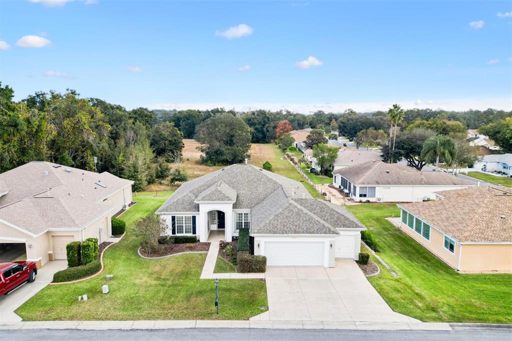 13655 Southeast 97th Terrace Road Summerfield, FL 34491 - Photo 1 of 49 an aerial view of a house with big yard