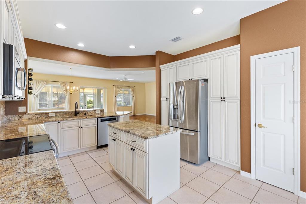 13655 Southeast 97th Terrace Road Summerfield, FL 34491 - Photo 17 of 49 a large kitchen with a counter top space and stainless steel appliances