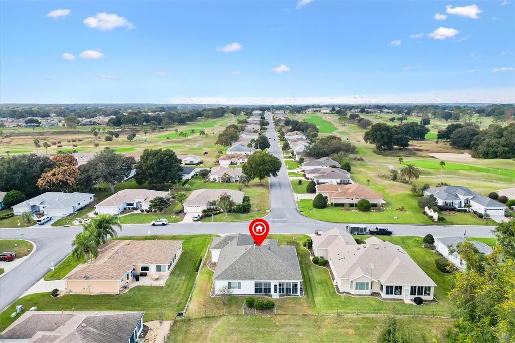 13655 Southeast 97th Terrace Road Summerfield, FL 34491 - Photo 2 of 49 an aerial view of residential houses with outdoor space and swimming pool