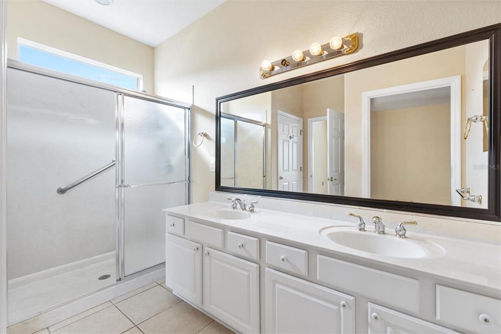 13655 Southeast 97th Terrace Road Summerfield, FL 34491 - Photo 25 of 49 a bathroom with a double vanity sink mirror and double