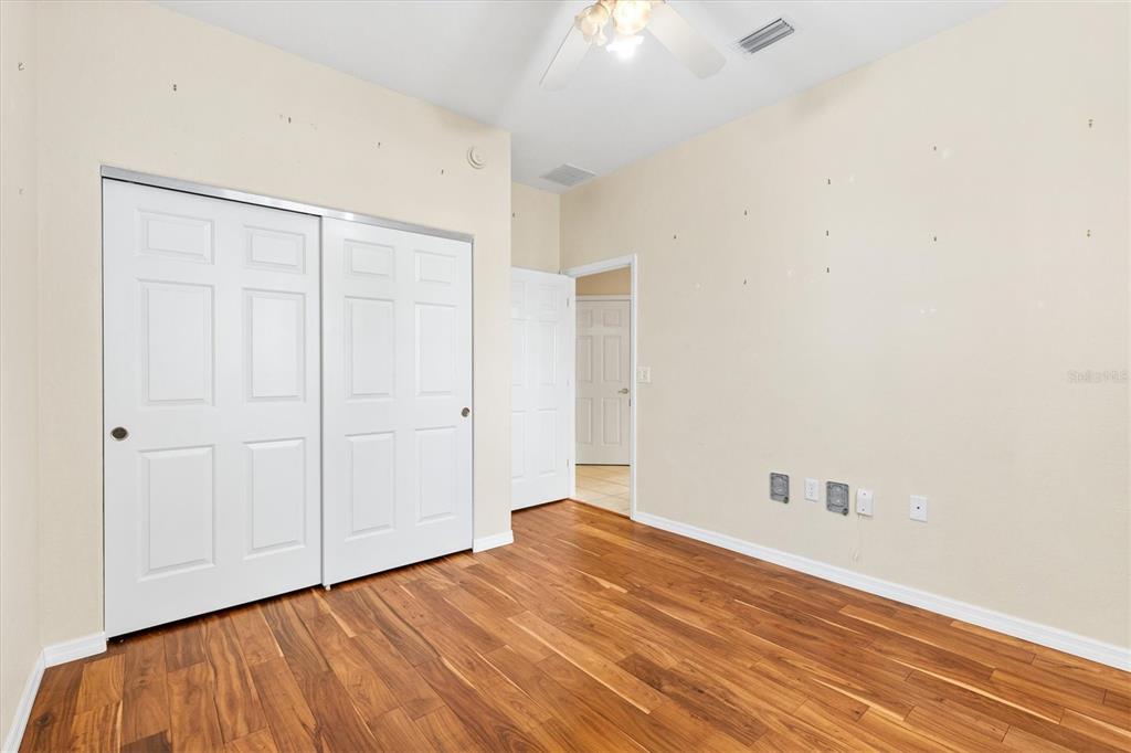 13655 Southeast 97th Terrace Road Summerfield, FL 34491 - Photo 29 of 49 a view of an empty room with wooden floor