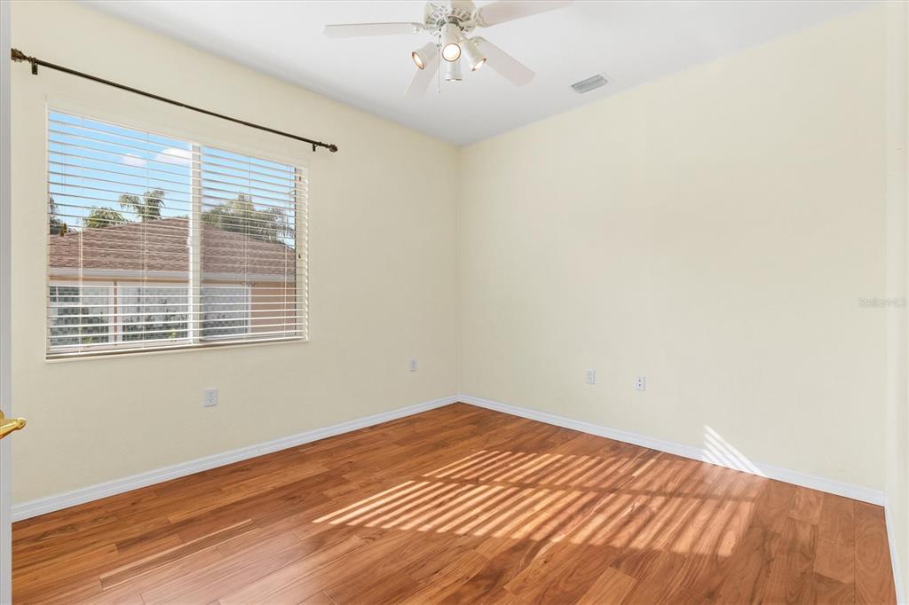 13655 Southeast 97th Terrace Road Summerfield, FL 34491 - Photo 31 of 49 a view of an empty room with wooden floor and a window