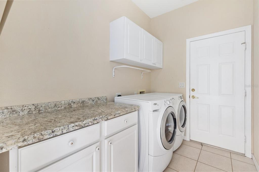 13655 Southeast 97th Terrace Road Summerfield, FL 34491 - Photo 39 of 49 a utility room with sink dryer and washer