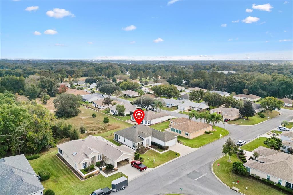 13655 Southeast 97th Terrace Road Summerfield, FL 34491 - Photo 49 of 49 an aerial view of a house with a garden