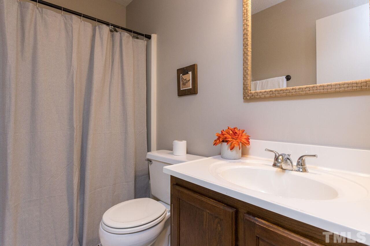 718 Red Forest Trail Raleigh, NC 27615 - Photo 18 of 30 Tub Shower combo, single vanity and new mirror and light. Freshly painted.