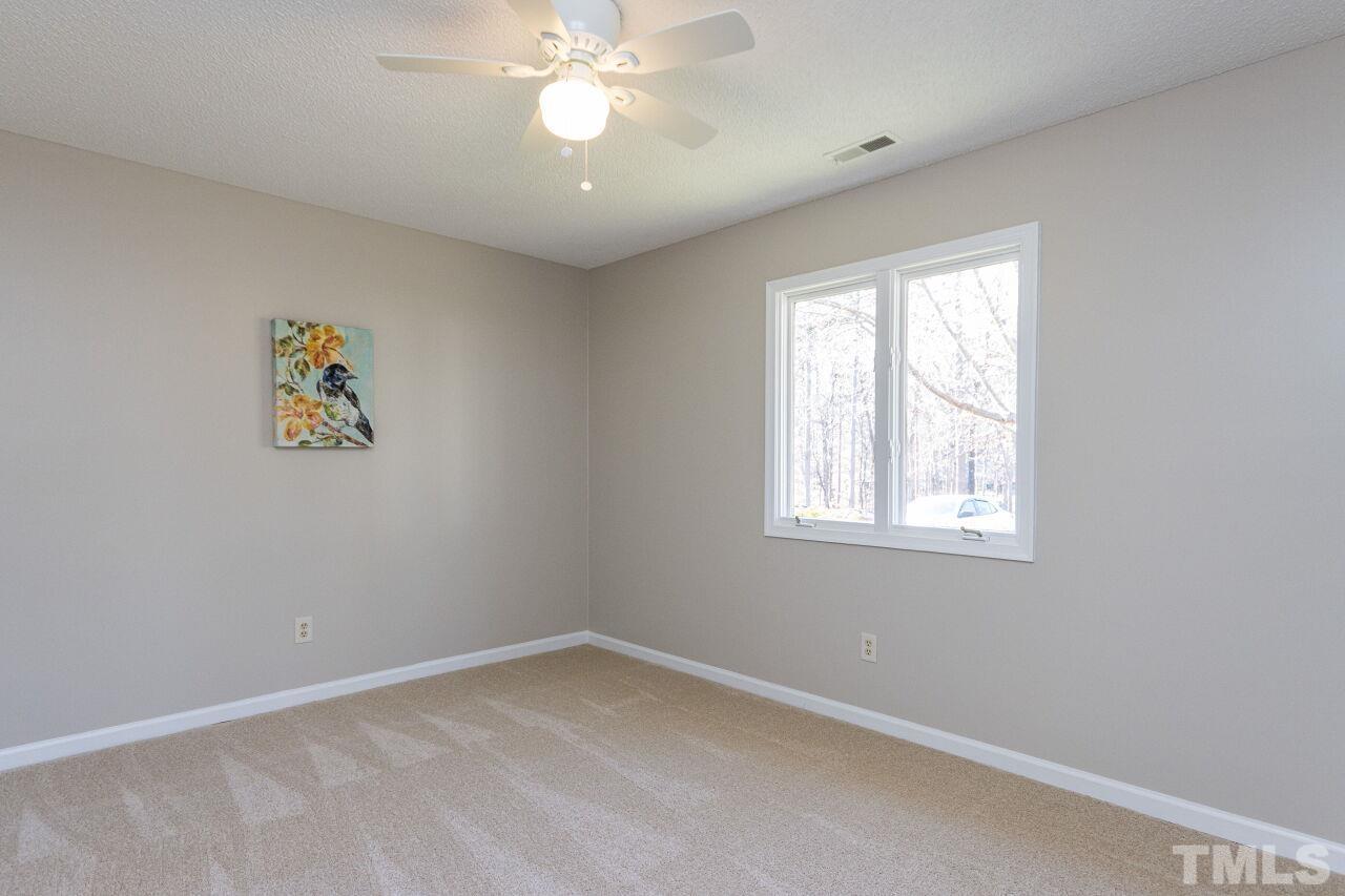 718 Red Forest Trail Raleigh, NC 27615 - Photo 23 of 30 Sun shines in this room in the morning. Faces the front of the home. Sizeable room with plenty of closet space. New carpet and paint. Large windows.