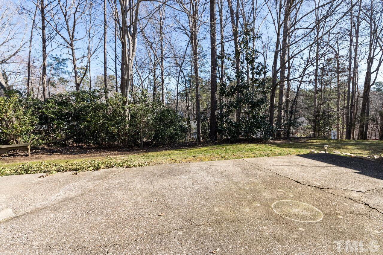 718 Red Forest Trail Raleigh, NC 27615 - Photo 26 of 30 Private yard with a large patio, large storage shed and beautiful trees.