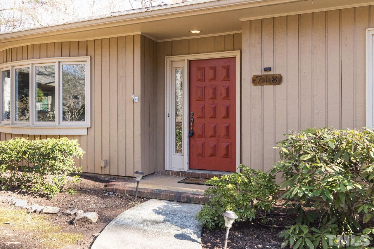 718 Red Forest Trail Raleigh, NC 27615 - Photo 3 of 30 Love the red orange pop of color on this mid-century front door.
