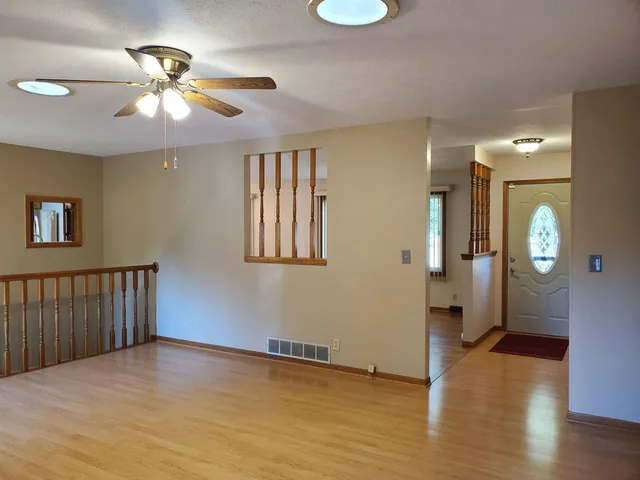 a kitchen with stainless steel appliances granite countertop a stove a sink dishwasher and a refrigerator