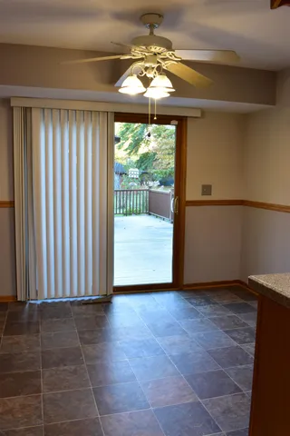 a kitchen with granite countertop cabinets and white appliances