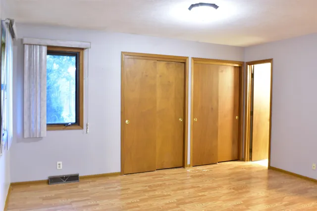 a view of entryway with wooden floor