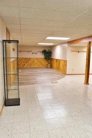 a view of a house with wooden floor and a fence