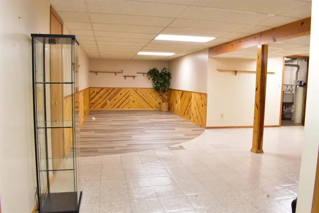 a front view of a house with a garden and outdoor seating