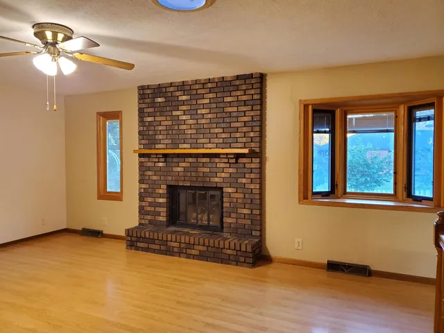 a view of a livingroom with wooden floor