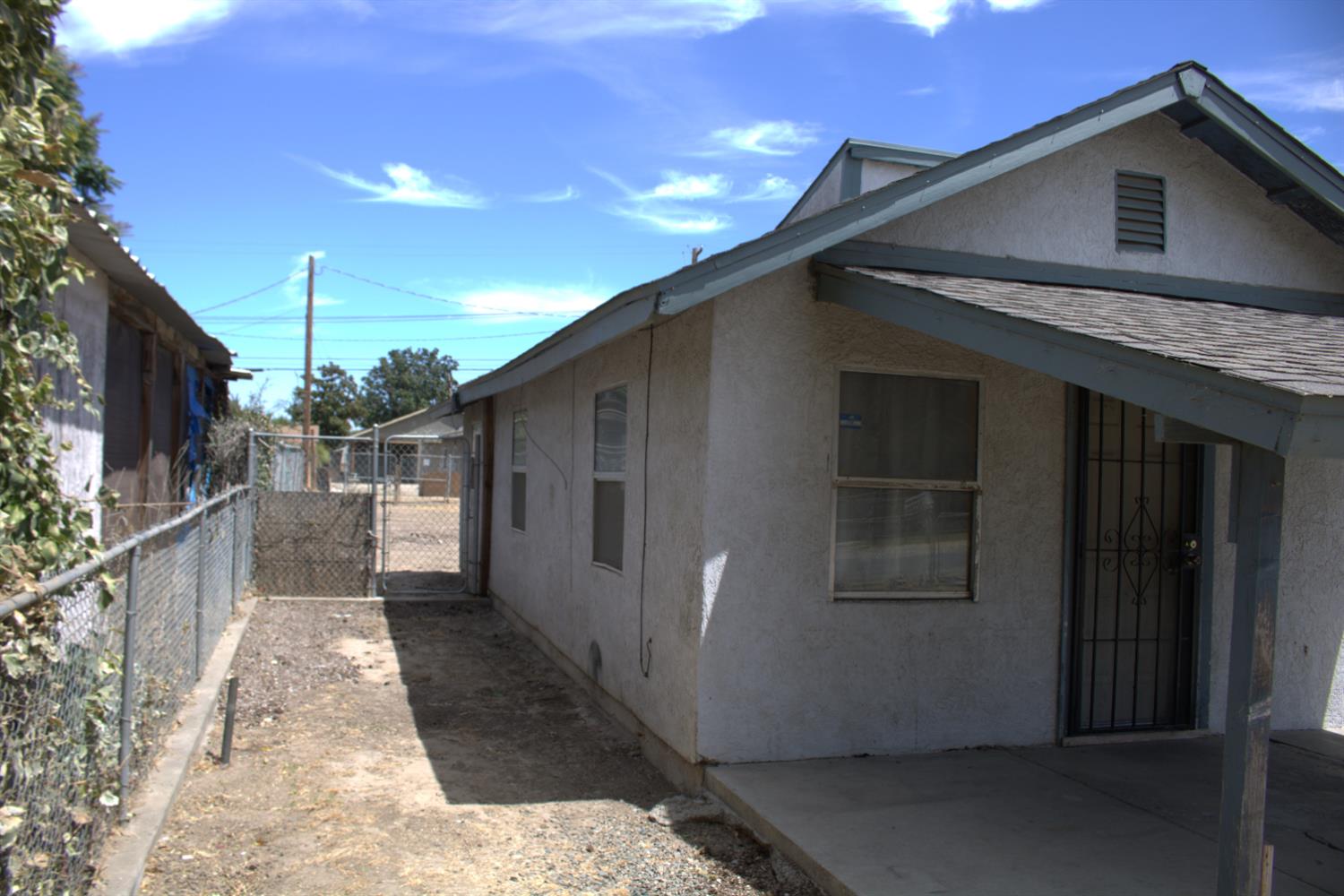 408 Thrasher Avenue Modesto, CA 95354 - Photo 4 of 13 a view of a house with a garage