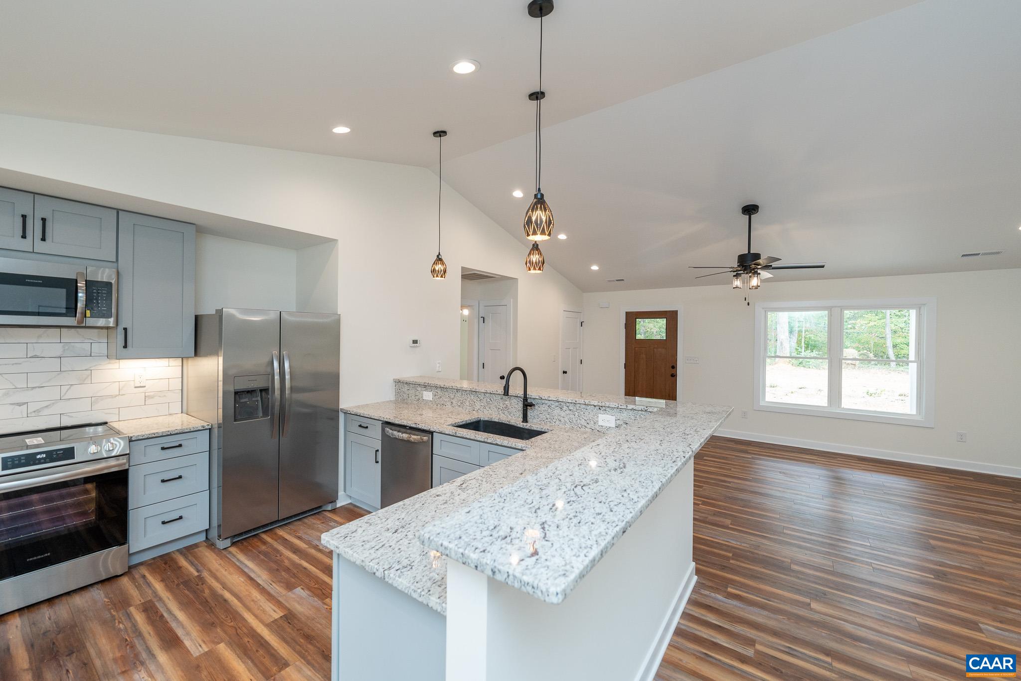 Lot 1 Ivy Road Howardsville, VA 24562 - Photo 12 of 34 a kitchen with stainless steel appliances granite countertop a sink stove and refrigerator