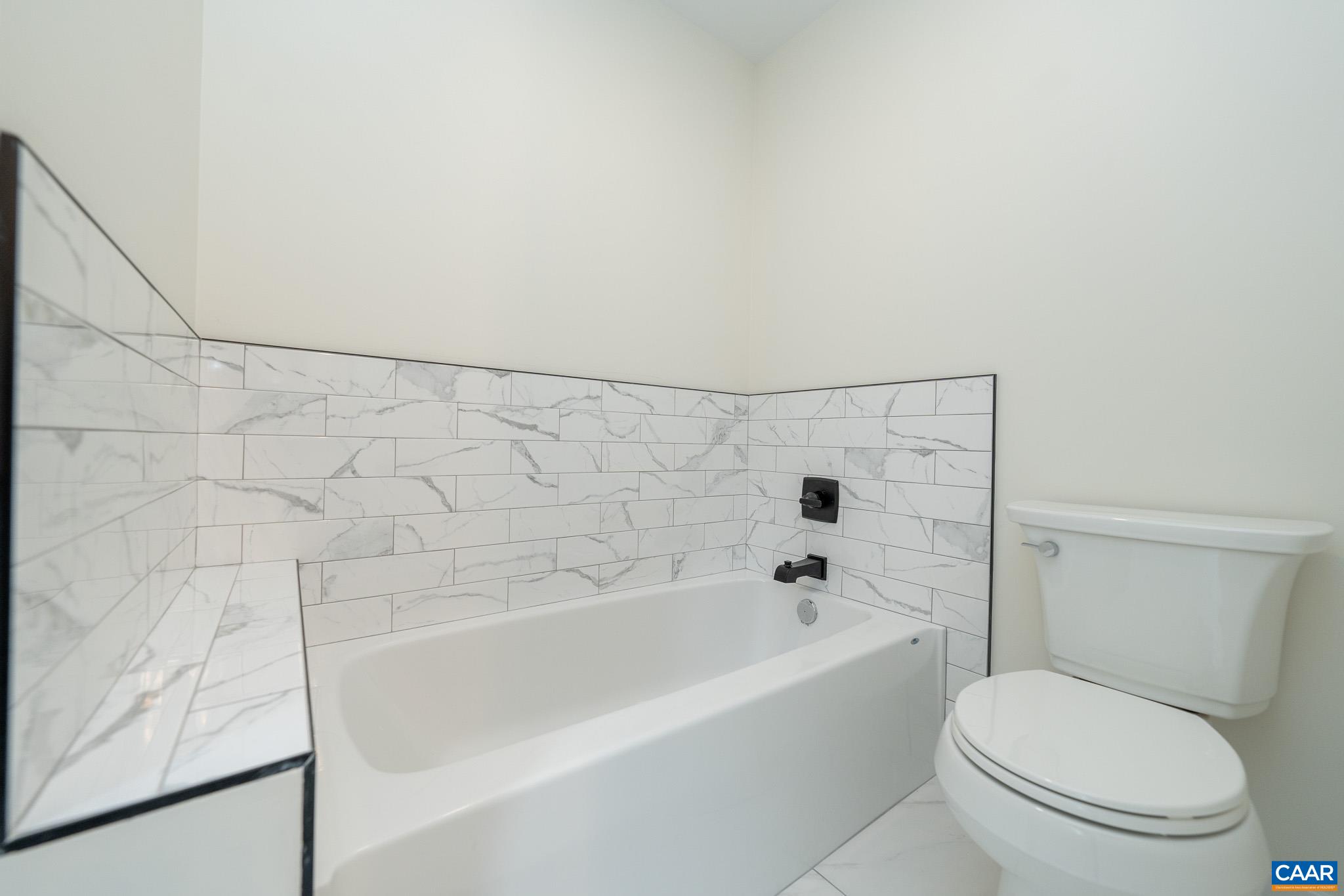 Lot 1 Ivy Road Howardsville, VA 24562 - Photo 17 of 34 a bathroom with a toilet and a bathtub
