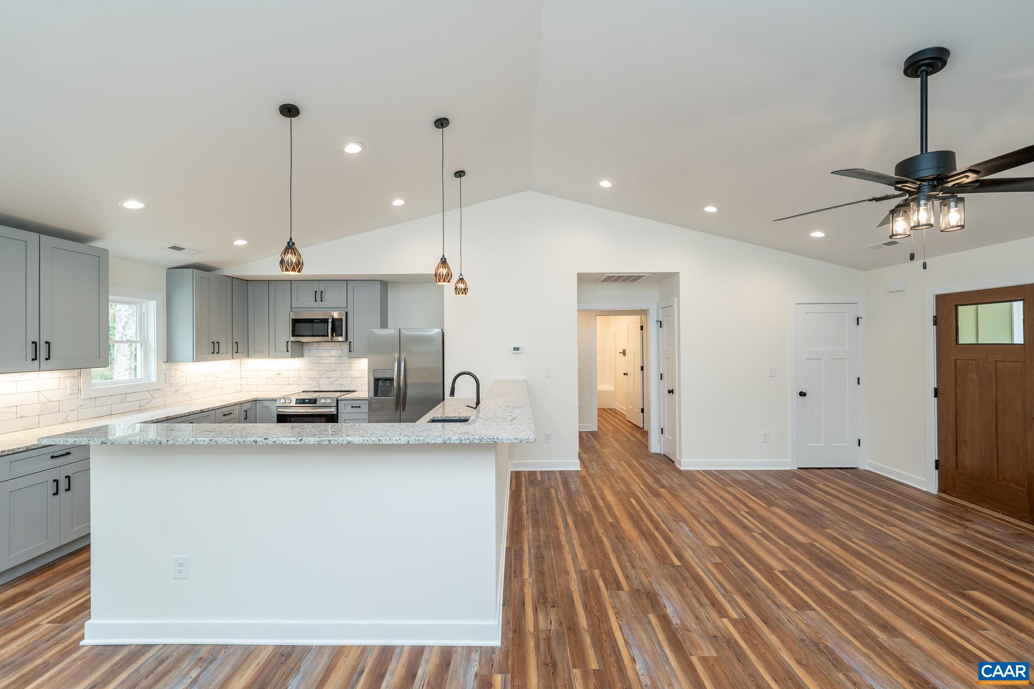 Lot 1 Ivy Road Howardsville, VA 24562 - Photo 23 of 34 a large kitchen with kitchen island a sink stainless steel appliances and cabinets