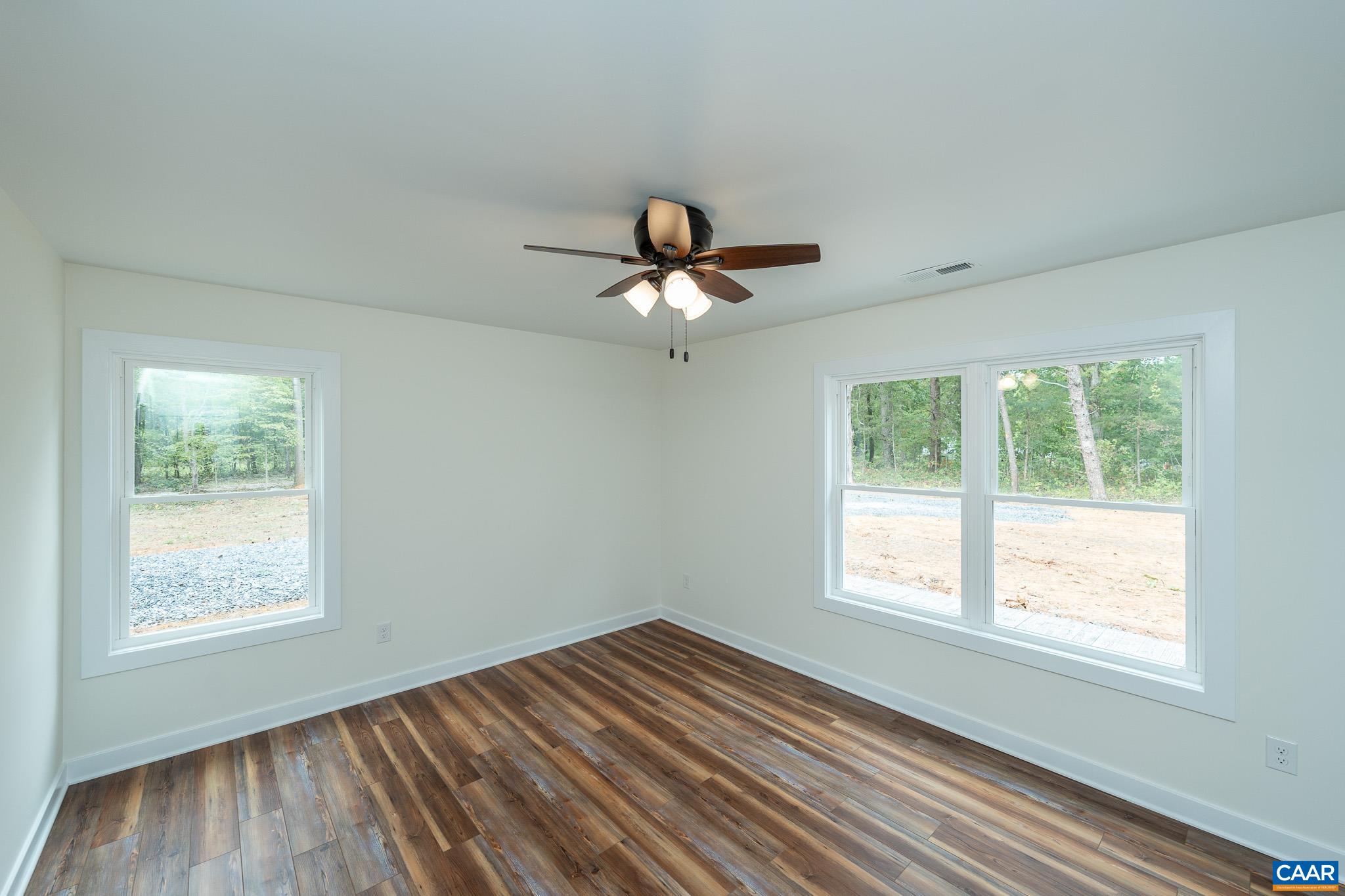 Lot 1 Ivy Road Howardsville, VA 24562 - Photo 24 of 34 a view of an empty room with wooden floor and a window