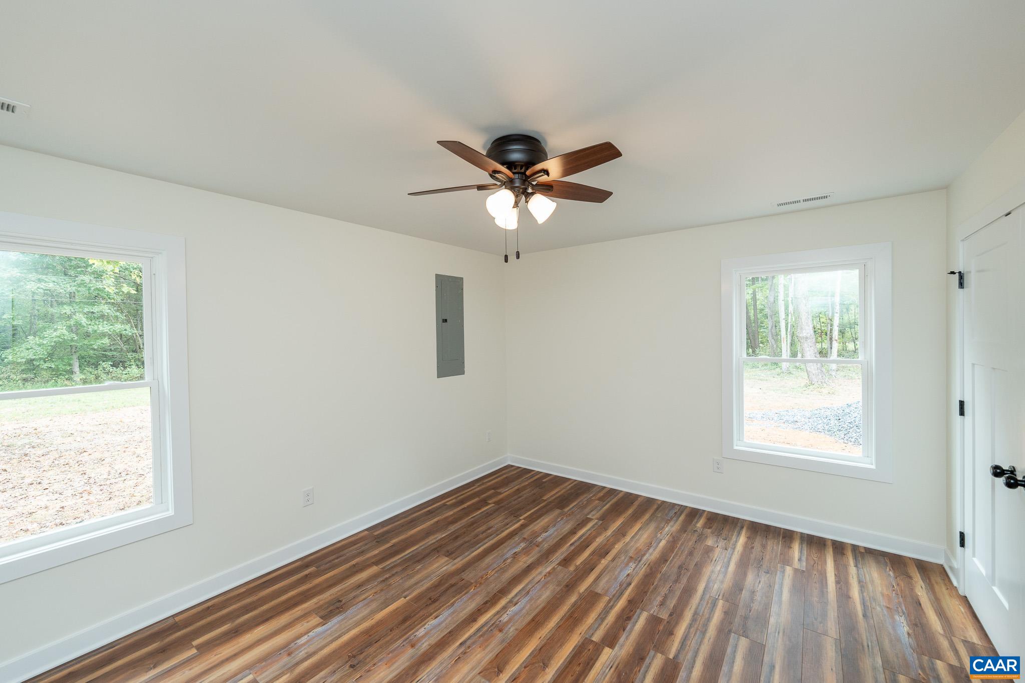 Lot 1 Ivy Road Howardsville, VA 24562 - Photo 26 of 34 a view of an empty room with a window and wooden floor