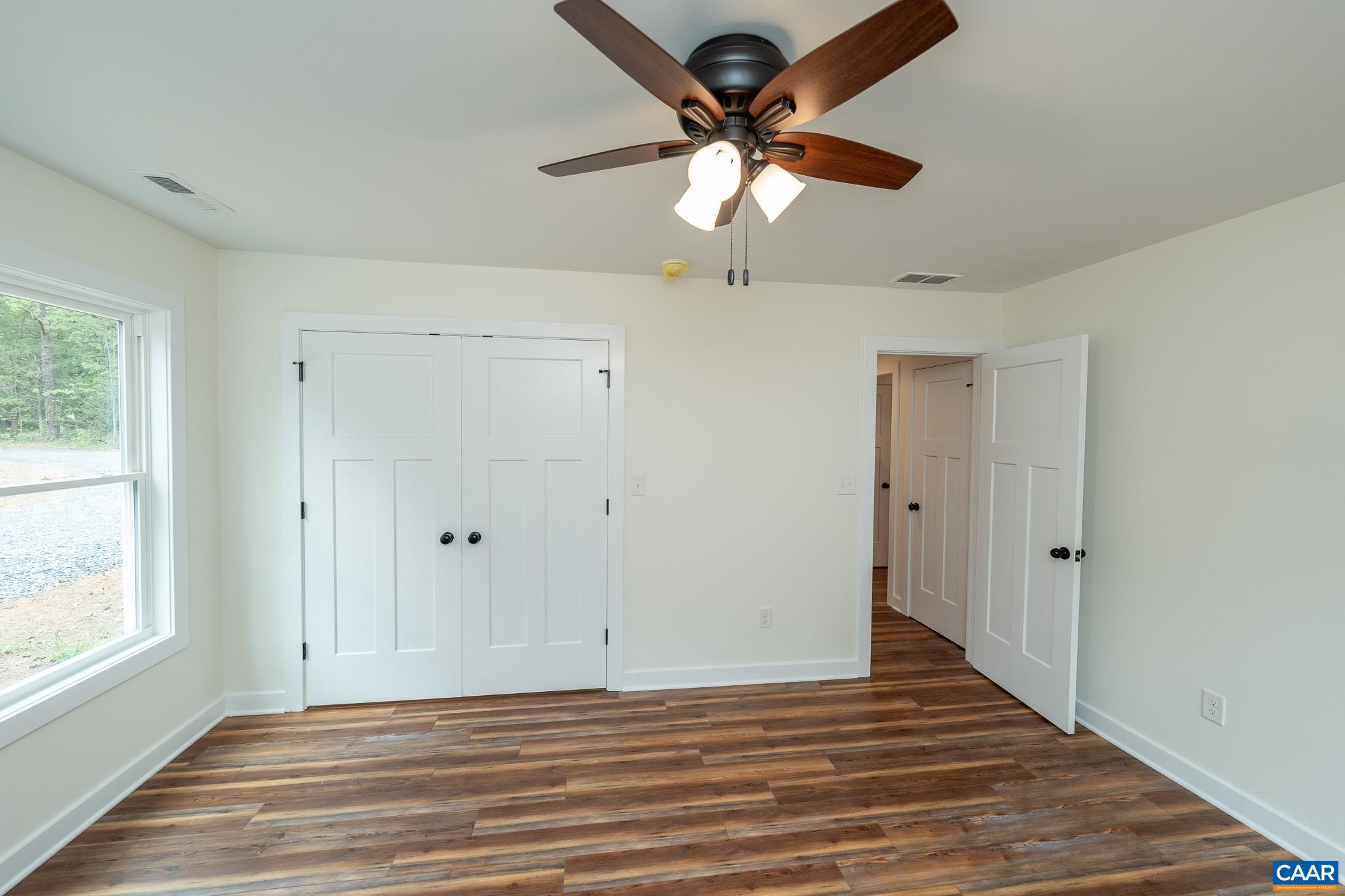Lot 1 Ivy Road Howardsville, VA 24562 - Photo 27 of 34 a view of a livingroom with a ceiling fan and window