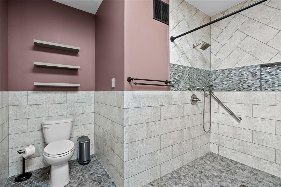 1506 Pleasant View Road Coopersburg, PA 18036 - Photo 58 of 97 A well-appointed bath boasts sleek tiled walls and a spacious shower.
