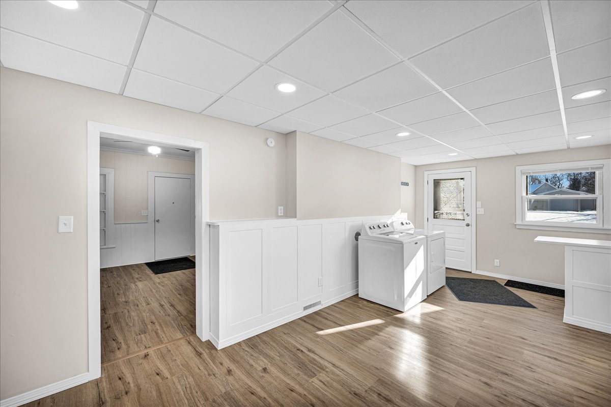 1406 West Walnut Street Bloomington, IL 61701 - Photo 11 of 32 a view of a big room with wooden floor and windows