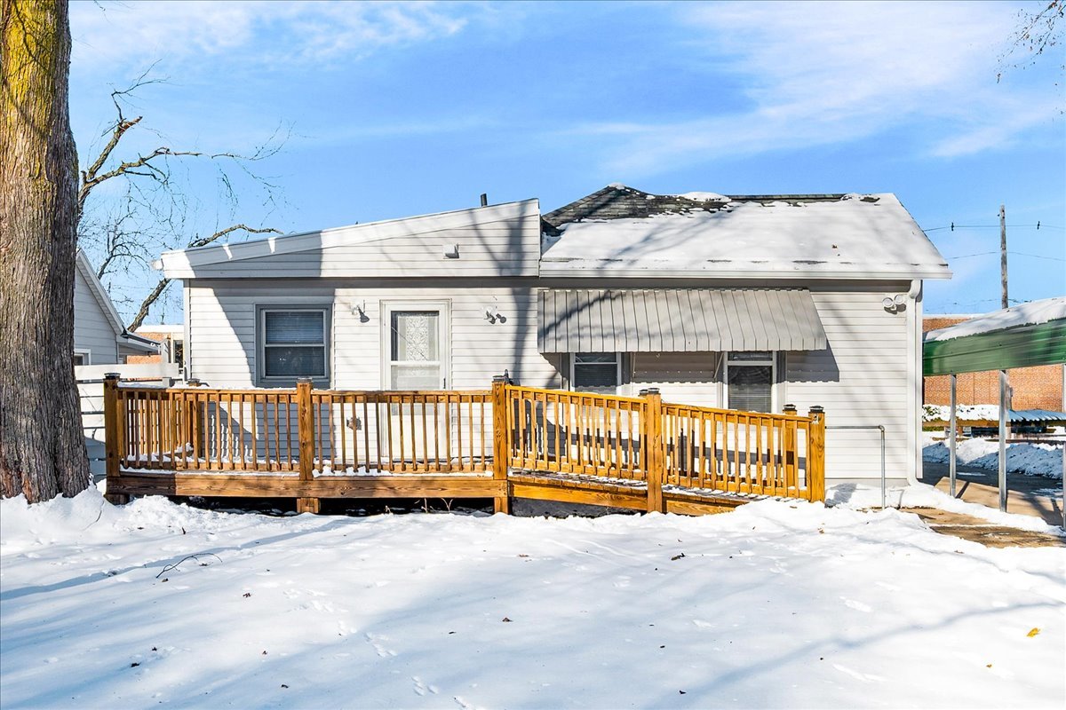 1406 West Walnut Street Bloomington, IL 61701 - Photo 29 of 32 a view of a brick house with wooden fence