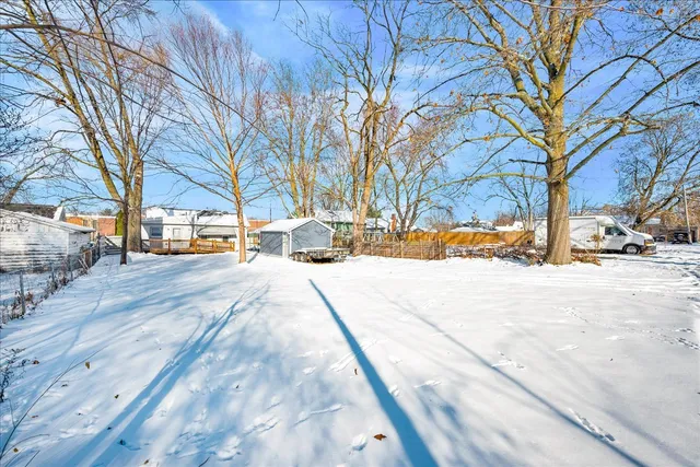a street view with snow on the road