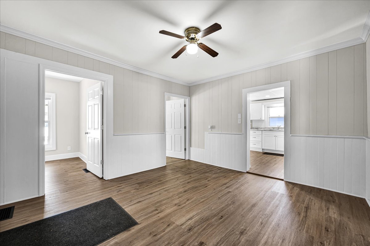 1406 West Walnut Street Bloomington, IL 61701 - Photo 6 of 32 wooden floor in an empty room with a window