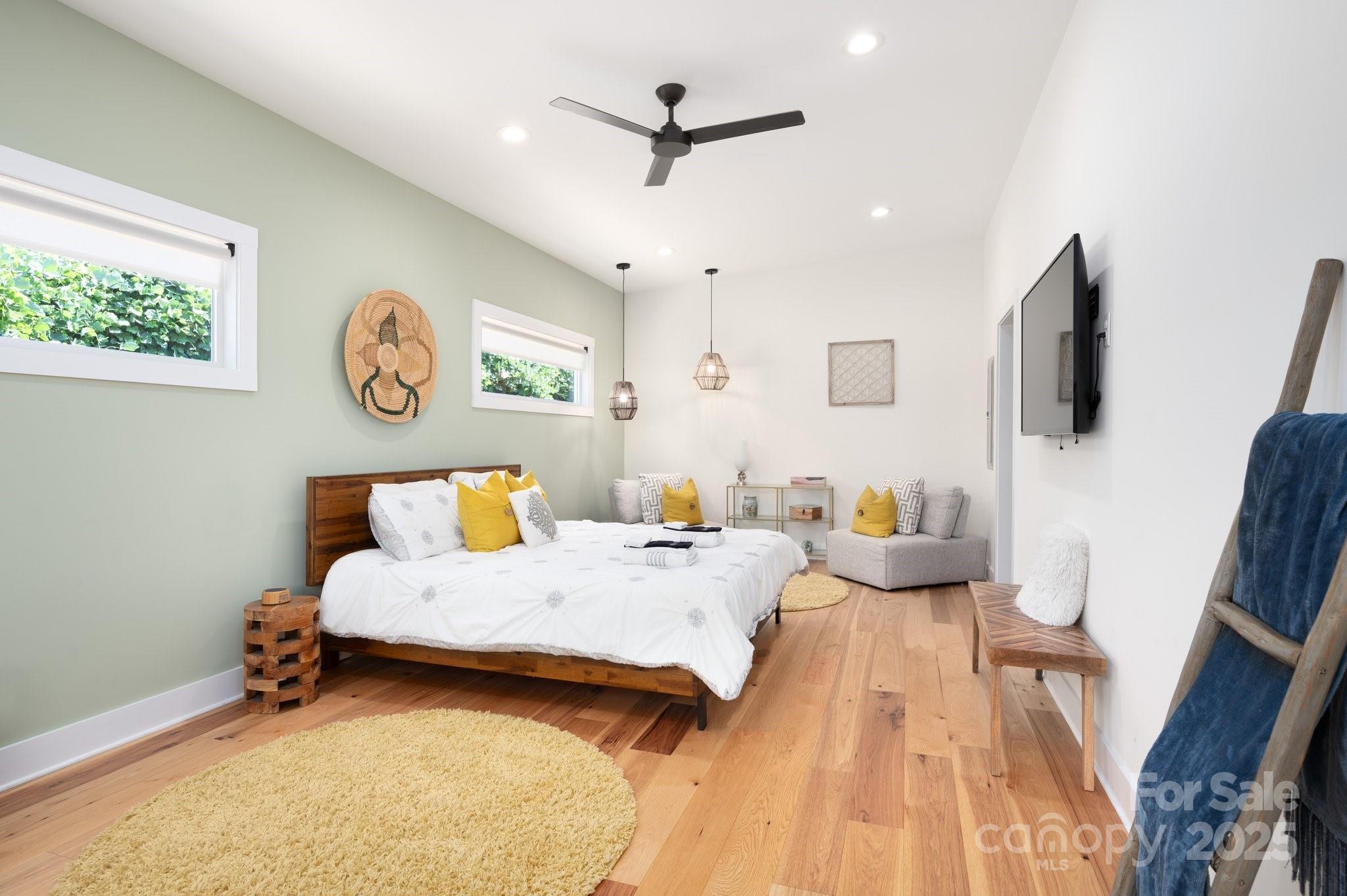 20 Garden Road Asheville, NC 28804 - Photo 17 of 44 a bedroom with a bed and a flat screen tv